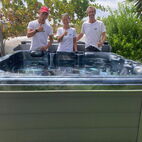 Algarve hot tub personel behind a newly intalled hot tub showing thumbs up.
